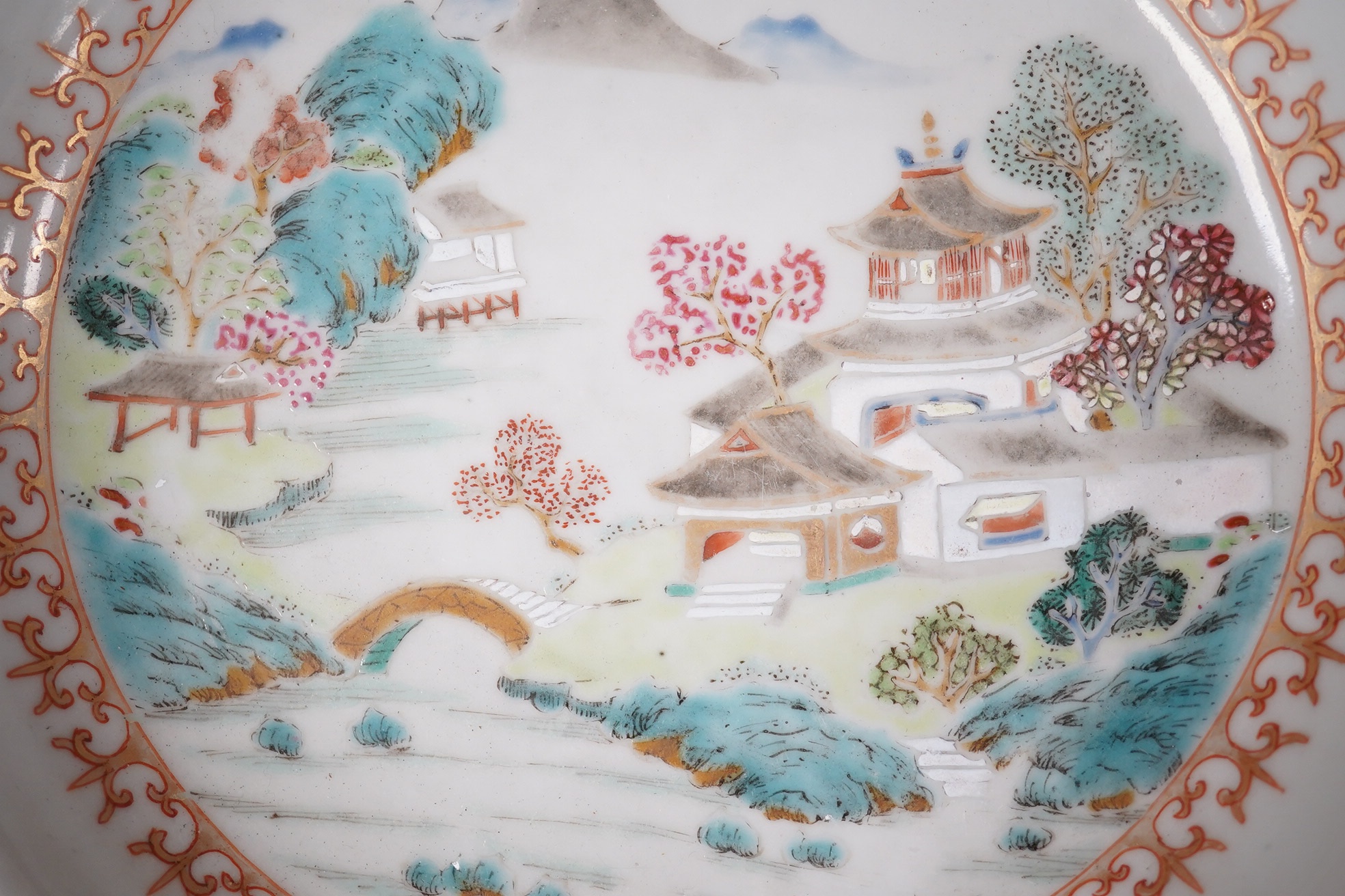 A Chinese Qianlong famille rose soup plate decorated with a landscape, diameter 23cm. Condition - fair to good